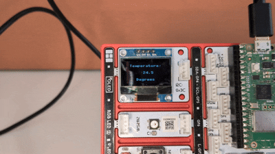 The live room temperature shown on the OLED screen